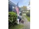 View of the entrance to the screened porch and manicured yard at 1124 Davidson Ave, Charleston, SC 29407