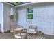 Cozy back patio seating area, perfect for outdoor relaxation on the paved area of the backyard at 1188 Camden St, North Charleston, SC 29405
