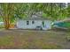 Lush backyard with mature trees provides a private oasis and plenty of room to relax at 1188 Camden St, North Charleston, SC 29405