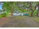 Large, private backyard with mature shade trees is perfect for outdoor recreation at 1188 Camden St, North Charleston, SC 29405