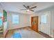 Minimalist bedroom with hardwood floors, lots of light, and closet at 1188 Camden St, North Charleston, SC 29405