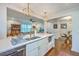 Bright kitchen features a spacious island with bar stool seating and stainless steel appliances at 1188 Camden St, North Charleston, SC 29405