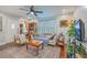 Cozy living room featuring a ceiling fan, wood floors, comfortable seating, and natural light at 1188 Camden St, North Charleston, SC 29405