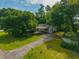 Quaint home with an extended driveway and carport area near trees at 145 Ravenell Dr, Saint Stephen, SC 29479
