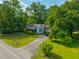 Charming one-story home with ample trees and a long driveway at 145 Ravenell Dr, Saint Stephen, SC 29479