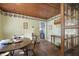Cozy dining area with wood accents, decorative plates, and an adjacent doorway at 145 Ravenell Dr, Saint Stephen, SC 29479