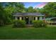 Charming home with green door detail and a cozy front porch at 145 Ravenell Dr, Saint Stephen, SC 29479