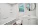 Well-lit bathroom with a bathtub, toilet, vanity, and a window for natural light at 1525 Westmoreland Ave, Charleston, SC 29412