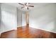 Bedroom with hardwood floors, a ceiling fan, and a double door closet at 1525 Westmoreland Ave, Charleston, SC 29412