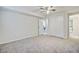 A bare bedroom featuring carpeting, a ceiling fan, and a double door closet at 1525 Westmoreland Ave, Charleston, SC 29412