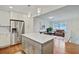 Open-concept kitchen and dining area featuring an island, stainless steel appliances, and modern decor at 1525 Westmoreland Ave, Charleston, SC 29412