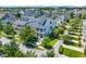 An aerial view of a neighborhood showcasing well-maintained homes and green landscaping on a sunny day at 1530 Willtown St, Daniel Island, SC 29492