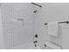 Bright bathroom with a subway tiled shower/bath and modern fixtures, including matte black plumbing at 1530 Willtown St, Daniel Island, SC 29492
