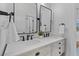 Modern bathroom vanity with double sinks, white quartz countertop, and a rustic wood cabinet at 1530 Willtown St, Daniel Island, SC 29492