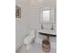 Charming powder room featuring shiplap walls, mosaic tile floor, and a unique vessel sink at 1530 Willtown St, Daniel Island, SC 29492