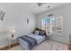 Well-lit bedroom features a single bed, hardwood floors, and a ceiling fan for added comfort at 1530 Willtown St, Daniel Island, SC 29492