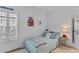 Cozy bedroom with ample natural light, a bed, and a peek into another room for an airy feel at 1530 Willtown St, Daniel Island, SC 29492