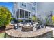 Outdoor fire pit with Adirondack chairs surrounded by greenery, offering a relaxing atmosphere at 1530 Willtown St, Daniel Island, SC 29492