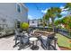 Inviting backyard with a brick fire pit, Adirondack chairs, and lush landscaping, perfect for outdoor entertaining at 1530 Willtown St, Daniel Island, SC 29492