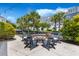 Outdoor fire pit with seating perfect for entertaining in a landscaped area with lush greenery at 1530 Willtown St, Daniel Island, SC 29492