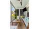 Relaxing porch with a ceiling fan and comfortable seating, perfect for enjoying the outdoors at 1530 Willtown St, Daniel Island, SC 29492