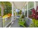 Cozy porch with seating and vibrant plants, creating a relaxing outdoor space at 1530 Willtown St, Daniel Island, SC 29492