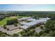 Aerial view of a school with sports fields and parking surrounded by a beautiful, established neighborhood at 1530 Willtown St, Daniel Island, SC 29492