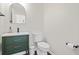 Clean half bathroom with a modern vanity, mirror, toilet, and black fixtures at 1543 Bluewater Way, Charleston, SC 29414