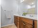 The bathroom features double vanity, tile floors, large mirror and modern fixtures at 1543 Bluewater Way, Charleston, SC 29414