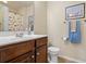 Bathroom featuring vanity with white sink, toilet and large mirror at 1543 Bluewater Way, Charleston, SC 29414