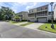 Townhome featuring private garages, front lawns, and screened-in porches at 1543 Bluewater Way, Charleston, SC 29414