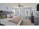 The main bedroom offers natural light, ceiling fan, neutral walls, and decorative decor at 1543 Bluewater Way, Charleston, SC 29414