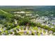 Aerial view featuring a home near a lush pond with mature trees, pinpointed with a map marker at 158 Balsam Cir, Summerville, SC 29485