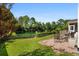 Serene backyard with a gravel patio and lush greenery, offering a private outdoor retreat at 158 Balsam Cir, Summerville, SC 29485
