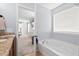 Bright bathroom with soaking tub and view into the bedroom at 158 Balsam Cir, Summerville, SC 29485