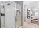 Bright bathroom showcasing a glass shower with built-in shelving and neutral colored walls at 158 Balsam Cir, Summerville, SC 29485