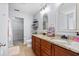Bathroom featuring double sinks with granite countertop and wood cabinets at 158 Balsam Cir, Summerville, SC 29485
