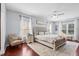 Well-lit bedroom featuring hardwood floors, neutral wall colors, and lots of natural light at 158 Balsam Cir, Summerville, SC 29485
