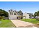 Inviting two-story house with a manicured lawn and a covered front porch at 158 Balsam Cir, Summerville, SC 29485