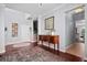 Elegant foyer welcomes with hardwood floors, decorative art, and a staircase leading to upper floors at 158 Balsam Cir, Summerville, SC 29485