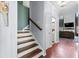 Hallway with staircase and views into the living room and bathroom at 158 Balsam Cir, Summerville, SC 29485