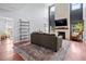 Open-concept living room with a fireplace and tall ceilings at 158 Balsam Cir, Summerville, SC 29485