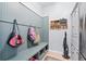 Well-organized mudroom with storage bench and coat hooks at 158 Balsam Cir, Summerville, SC 29485