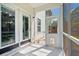Cozy screened porch with access to the outside at 158 Balsam Cir, Summerville, SC 29485