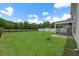 A sprawling backyard offers lush green grass and a privacy fence at 158 Netherfield Dr, Summerville, SC 29486