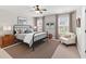 A staged bedroom with bed, bedside tables, and chair at 158 Netherfield Dr, Summerville, SC 29486