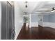 Inviting entryway featuring hardwood floors, wainscoting, and a view into the living area at 158 Netherfield Dr, Summerville, SC 29486
