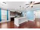 Bright kitchen featuring a large island, dark cabinetry, stainless steel appliances, and sleek countertops at 158 Netherfield Dr, Summerville, SC 29486