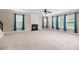 Large living room featuring a fireplace, large windows, and neutral carpeting at 158 Netherfield Dr, Summerville, SC 29486