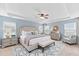 This is a spacious main bedroom with tray ceiling and light blue accent walls at 158 Netherfield Dr, Summerville, SC 29486